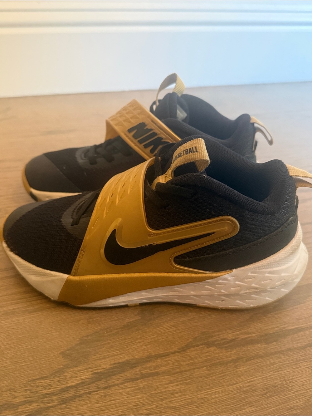Nike Kids' Hustle D12 Black and Gold Slip-On Sneakers with Strap
